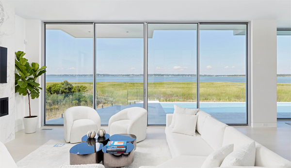 costs and price range for modern home with floor-to-ceiling windows and doors